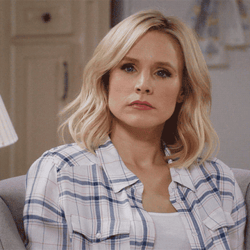 Kristen Bell nodding in disappointment