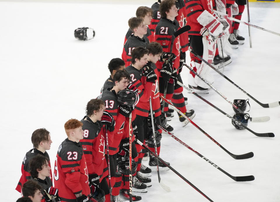 Canada players line up following their quarterfinal hockey loss against Czechia at the IIHF World Junior Hockey Championship in Gothenburg, Sweden, Tuesday, Jan. 2, 2024. (Christinne Muschi/The Canadian Press via AP)
