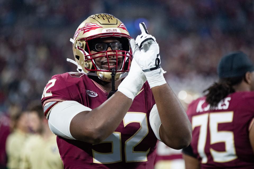 Florida State Seminoles offensive lineman Robert Scott Jr. celebrates his team's victory over Louisville on Dec. 2. FSU was left out of the College Football Playoffs, despite their undefeated season.