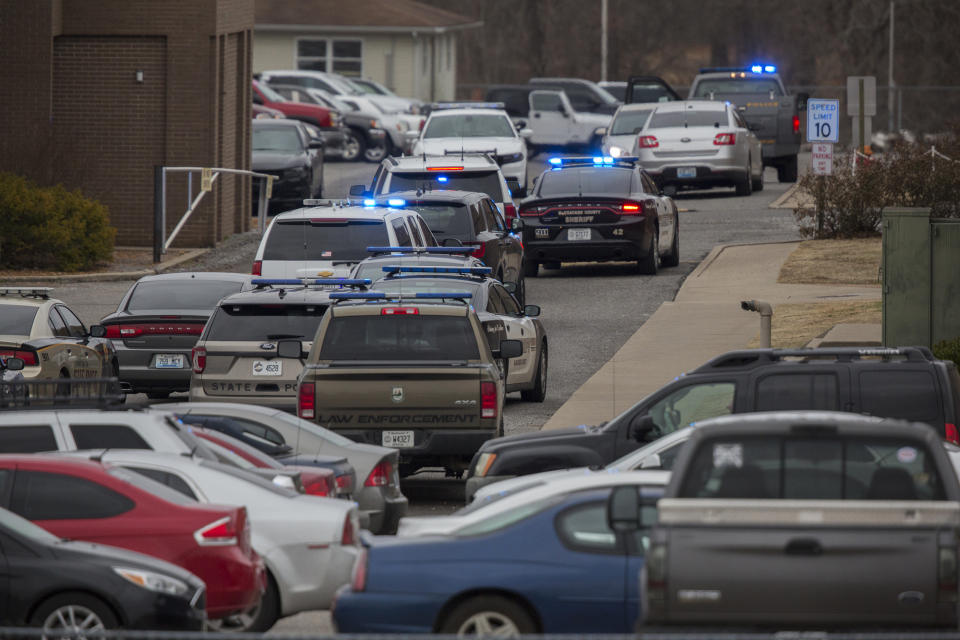 <p>Emergency crews respond to Marshall County High School after a fatal school shooting on Jan. 23, 2018, in Benton, Ky. (Photo: Ryan Hermens/The Paducah Sun via AP) </p>