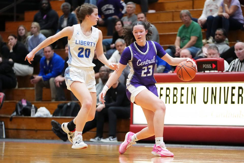 Pickerington Central's Berry Wallace (23) dribbles past Olentangy Liberty's Maria Stack (20) during Tuesday night's regional semifinal.