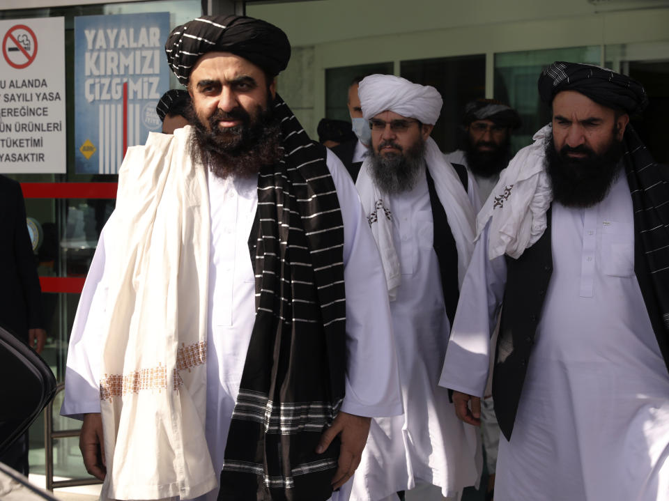 The Taliban delegation led by Amir Khan Muttaqi, the acting foreign minister, front, at Esenboga Airport, arrive in Ankara, Turkey, Thursday, Oct. 14, 2021. A high-level delegation of Afghanistan's new Taliban rulers has arrived in Turkey for talks with Turkish officials, the Foreign Ministry announced Thursday. The meetings in the capital of Ankara would be first between the Taliban and senior Turkish government officials after the group seized control of Afghanistan. (AP Photo/Burhan Ozbilici)