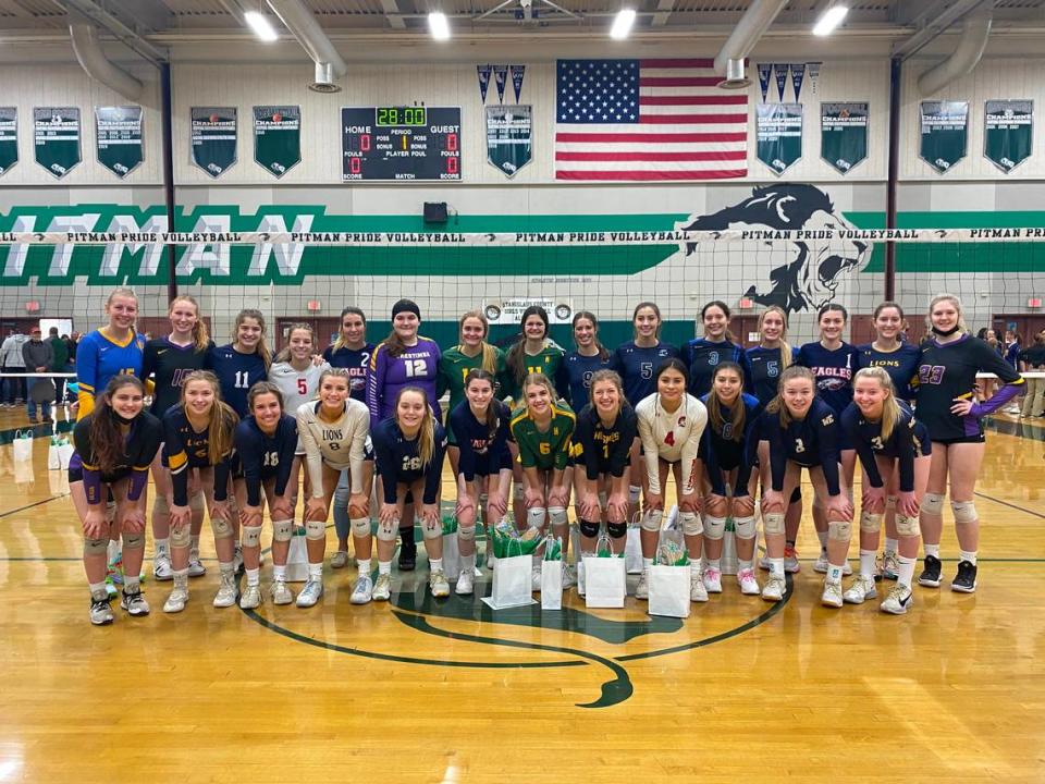 Members of the small-school teams pose for a picture after their match at the third annual Stanislaus District Volleyball All-Star Game at Pitman High School on Sunday, Dec. 5, 2021.