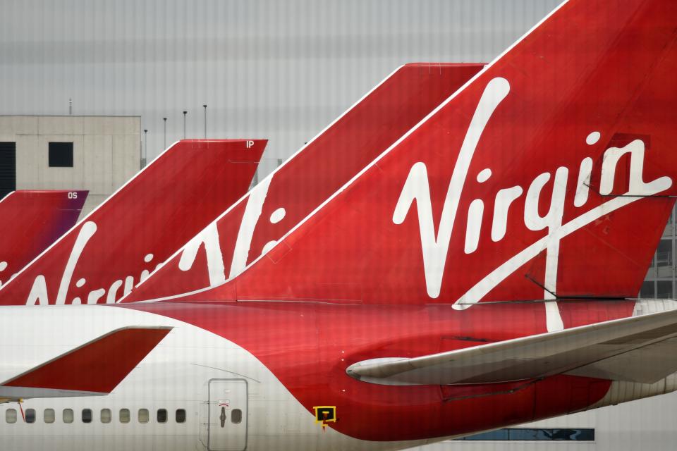 Virgin Atlantic Airline planes are pictured at the apron at Manchester Airport in north-west England, on June 8, 2020, as the UK government's planned 14-day quarantine for international arrivals to limit the spread of the novel coronavirus begins. (Photo by Oli SCARFF / AFP) (Photo by OLI SCARFF/AFP via Getty Images)