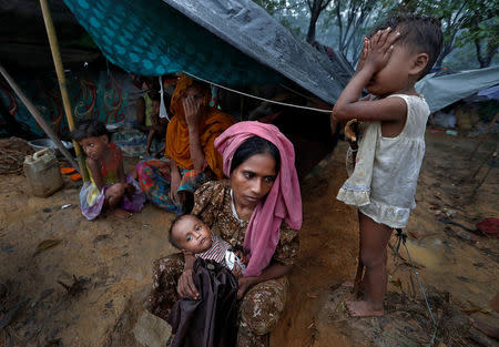 Rohingya refugees wait in a camp in Cox's Bazar, Bangladesh, September 17, 2017. REUTERS/Cathal McNaughton