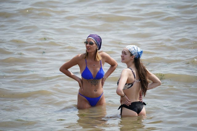 People in the water at Southend-on-Sea on the Thames Estuary in Essex