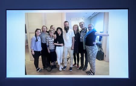 A picture of freed hostage Johan Gustafsson and his family at Arlanda airport after his arrival in Sweden on Monday, is shown during a press conference with Swedish Foreign Minister Margot Wallstrom at government headquarters in Stockholm, Sweden June 26, 2017. TT News Agency/Marcus Ericsson via REUTERS