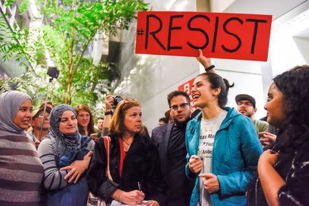 Niloofar Radgoudarzi thanking the crowd for protesting after her father was released from custody after being detained in San Francisco International Airport in San Francisco, California, U.S., January 28, 2017. REUTERS/Kate Munsch