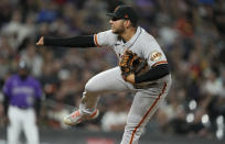 San Francisco Giants relief pitcher Kervin Castro works against the Colorado Rockies in the fifth inning of a baseball game Friday, Sept. 24, 2021, in Denver. (AP Photo/David Zalubowski)