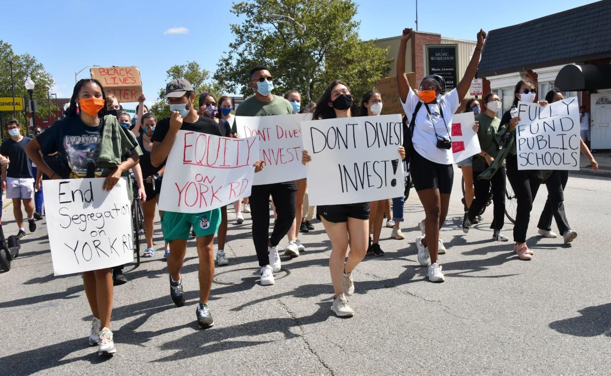 Group Marches To Highlight Disparities In Baltimore Neighborhoods Surrounding Johns Hopkins 