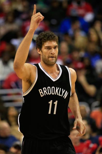Brook Lopez signals for the check. (Rob Carr/Getty Images)