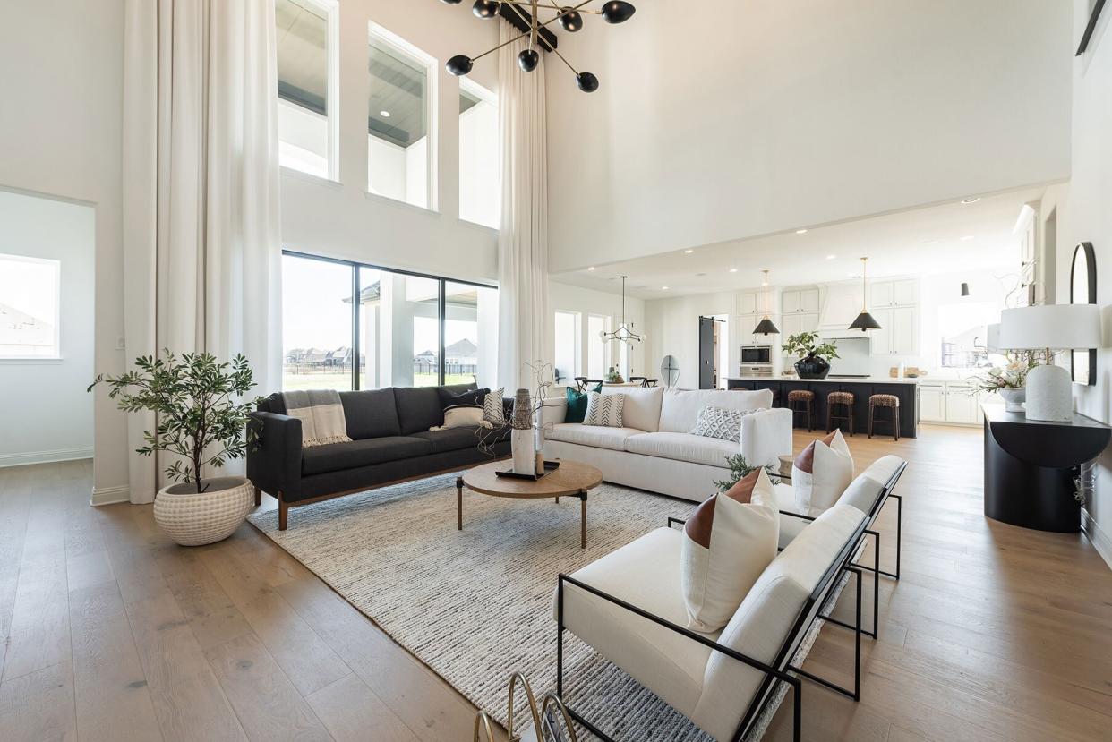 Open Floor Plan with White Walls and Tall Ceiling