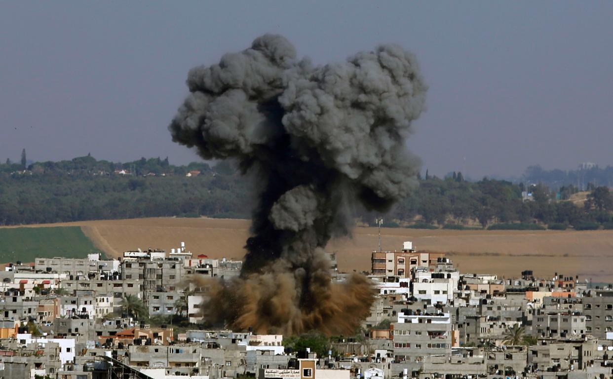 Smoke rises after an Israeli airstrike in Gaza City, Tuesday, May 11, 2021.