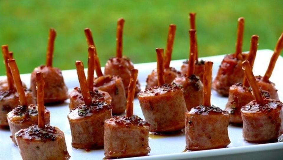 <p>Noble Pig</p><p>Sausage bites with a maple-mustard glaze and an edible toothpick.</p><p><strong>Get the recipe: <a href="https://noblepig.com/2022/12/maple-glazed-sausage-bites/" rel="nofollow noopener" target="_blank" data-ylk="slk:Maple-Glazed Apple-Chicken Sausage Bites;elm:context_link;itc:0;sec:content-canvas" class="link ">Maple-Glazed Apple-Chicken Sausage Bites</a></strong></p>