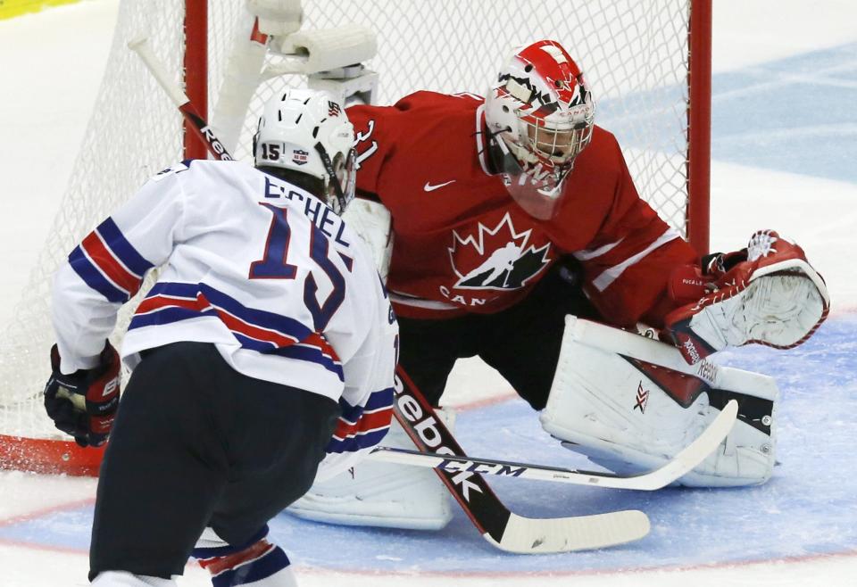 Canada's goalie Fucale makes a save against United States' Eichel during the first period of their IIHF World Junior Championship ice hockey game in Malmo