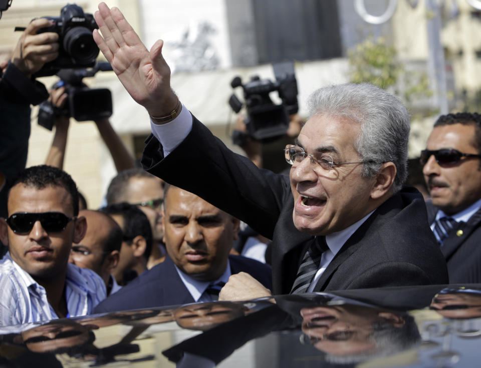 Presidential hopeful leftist politician Hamdeen Sabahi, who finished a strong third in the first round of the last presidential election, in June 2012, greets his supporters outside the election commission office in Cairo, Egypt, Saturday, April 19, 2014. Sabahi submitted required signatures to the election commission as the final formal step to run in next month’s presidential election. The presidential ballot will be followed by a parliamentary election later this year. (AP Photo/Amr Nabil)