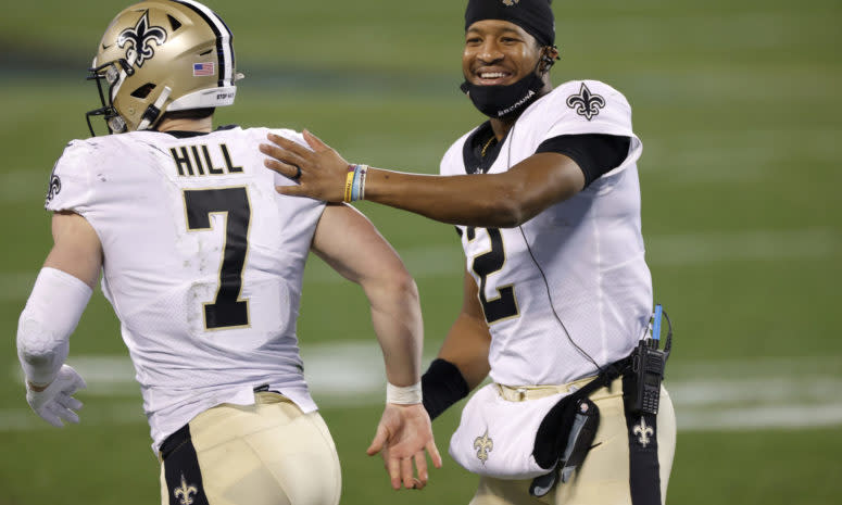 Jameis Winston and Taysom Hill celebrating.