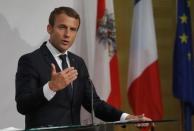 French President Emmanuel Macron speaks to the media at a press conference in Salzburg, Austria, August 23, 2017.