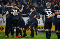 Soccer Football - Bundesliga - VfB Stuttgart vs Borussia Dortmund - Mercedes-Benz Arena, Stuttgart, Germany - November 17, 2017 Stuttgart coach Hannes Wolf celebrates after the match with players REUTERS/Kai Pfaffenbach