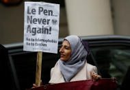 <p>A demonstrator holds a banner during an anti-fascist protest outside the French Embassy in London, Britain April 24, 2017. (Stefan Wermuth/Reuters) </p>