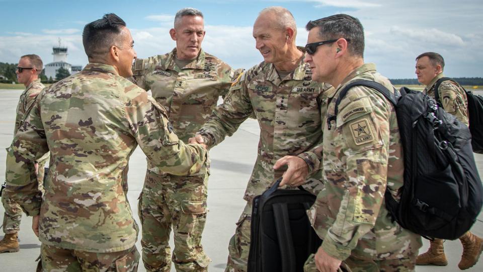 Maj. Gen. David Doyle, commanding general of the 4th Infantry Division and Fort Carson and Command Sgt. Maj. Alex Kupratty, command sergeant major of the 4th Infantry Diviision and Fort Carson, Colorado welcome the then-Vice Chief of Staff of the Army, Gen. Randy George and Sgt. Maj. of the Army Michael R. Weimer during a visit to Powidz, Poland, Aug. 26, 2023. (Spc. Joshua Zayas/Army)