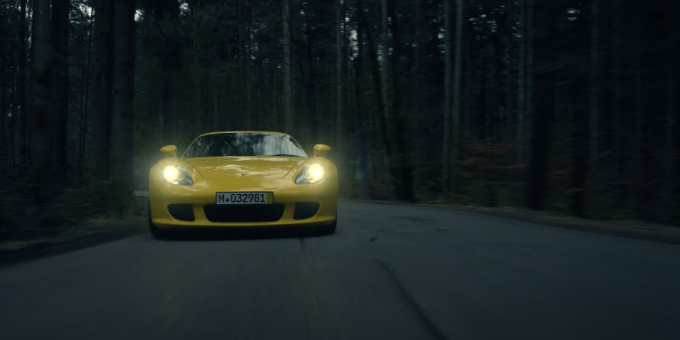 porsche carrera gt yellow on road front fascia shot