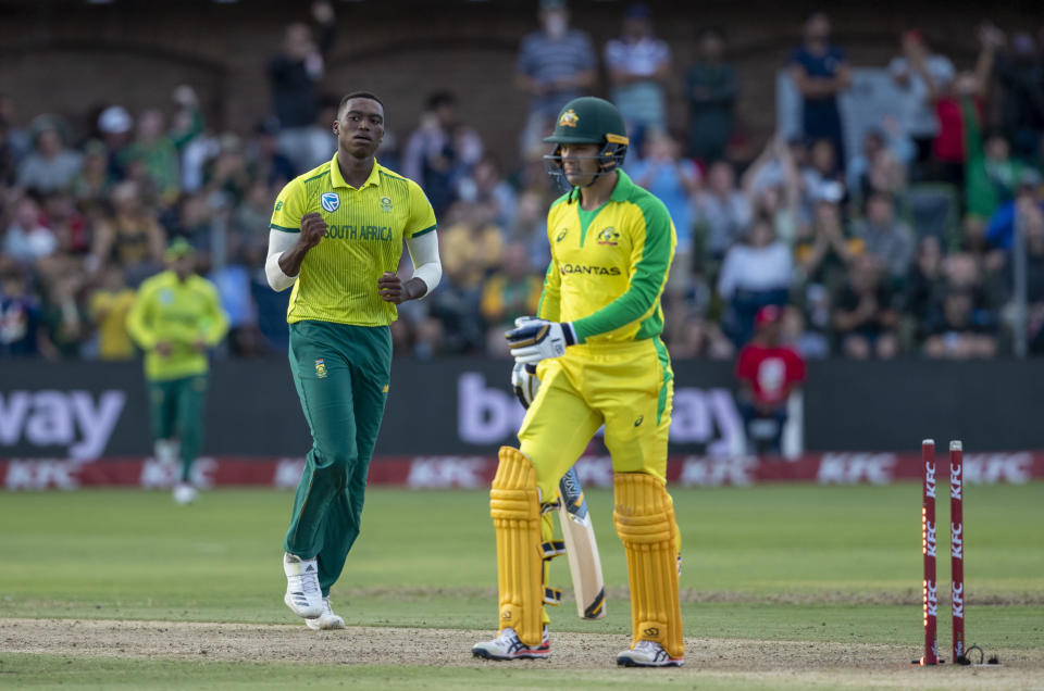 South Africa's bowler Lungi Ngidi, left, celebrates after bowling Australia's batsman Alex Carey for 14 runs during the 2nd T20 cricket match between South Africa and Australia at St George's Park in Port Elizabeth, South Africa, Sunday, Feb. 23, 2020. (AP Photo/Themba Hadebe)