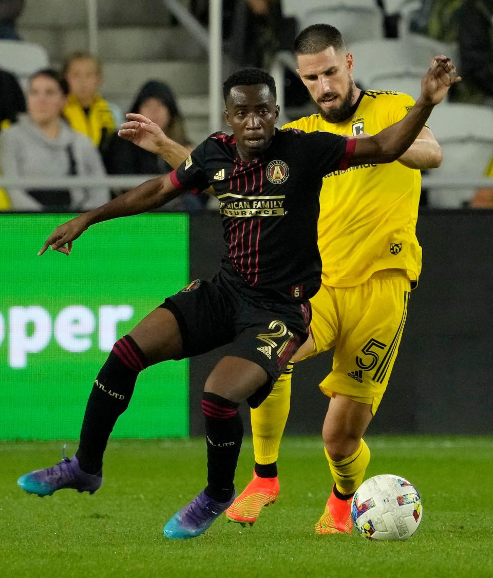 August 21, 2022; Columbus, Ohio, USA;  Atlanta United forward Edwin Mosquera (21) and Columbus Crew defender Milos Degenek (5) during the second half of Sunday's MLS match at Lower.com Field in Columbus, Oh. Mandatory Credit: Barbara J. Perenic/Columbus Dispatch