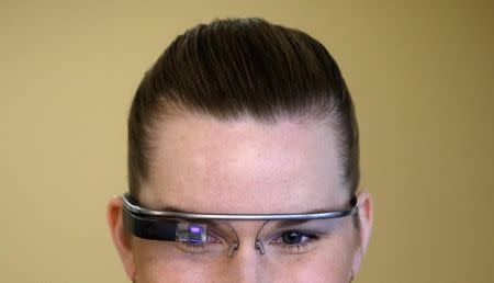 A woman wears Google glasses after a media presentation of a Google apartment in Prague May 15, 2014. REUTERS/David W Cerny