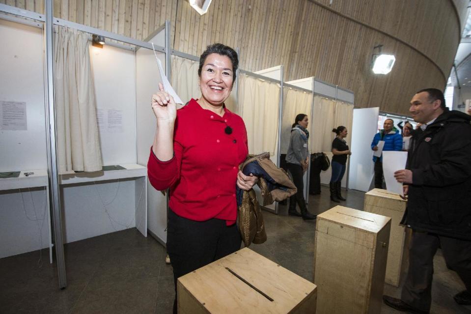 Aleqa Hammond from Siumut casting her vote during the general election, in Nuuk, Greenland Tuesday, March 12, 2013. Voting stations opened in Greenland to elect the semi-autonomous nation's 31-seat Parliament amid a strategic debate over how to handle potentially vast underground mineral wealth. Left-leaning Premier Kuupik Kleist wants to maintain a zero-tolerance policy on mining radioactive minerals, a byproduct of extracting rare earth metals, while challenger Aleqa Hammond — potentially Greenland's first female head of government — is prepared to tap them.(AP Photo/Polfoto, Sermitsiaq, Leiff Josefsen) DENMARK OUT