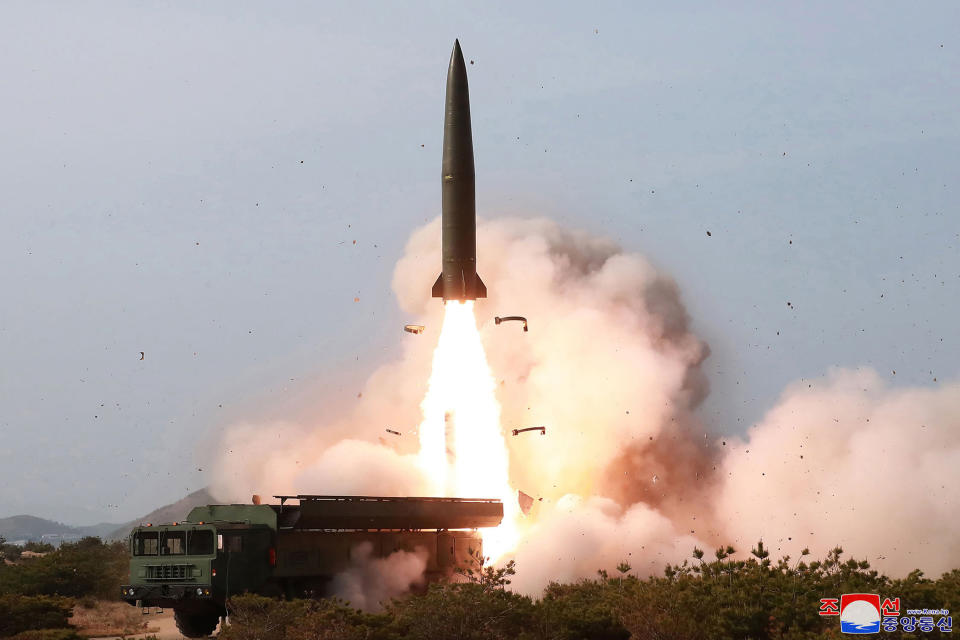 FILE - This May 4, 2019, file photo provided by the North Korean government shows what it says a launch of a missile in the east coast of North Korea. The Abe government's Defense White Paper 2020 highlights what are potential Chinese and North Korean threats as Japan tries to further increase its defense capability. (Korean Central News Agency/Korea News Service via AP, File)