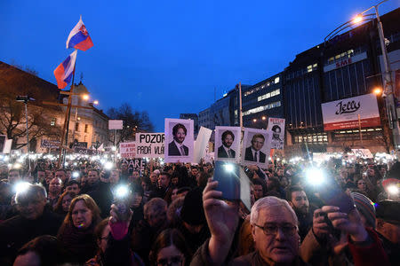 FILE PHOTO: Demonstrators attend a protest called "Let's stand for decency in Slovakia" in reaction to the murder of Slovak investigative reporter Jan Kuciak and his fiancee Martina Kusnirova, in Bratislava, Slovakia March 9, 2018. REUTERS/Radovan Stoklasa