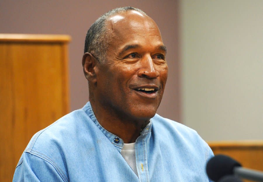 FILE – In this July 20, 2017, file photo, former NFL football star O.J. Simpson appears via video for his parole hearing at the Lovelock Correctional Center in Lovelock, Nev. The 74-year-old former football hero, acquitted California murder defendant and convicted Las Vegas armed robber was granted good behavior credits and discharged from parole effective Dec. 1, the day after a hearing before the Nevada state Board of Parole, Kim Yoko Smith, spokeswoman for the Nevada State Police, said Tuesday, Dec. 14, 2021. (Jason Bean/The Reno Gazette-Journal via AP, Pool, File)