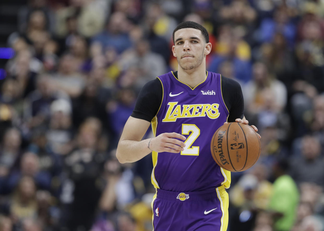 Lonzo Ball will need more time to recover after offseason knee surgery. (AP Photo)