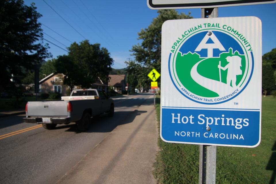 An sign that welcomes hikers to Hot Springs shows the connection between the town and the Appalachian Trail Conservancy.