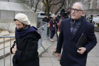 Isabel and Kevin Maxwell leave the courthouse during a lunch break in the trial of their sister, Ghislaine Maxwell, in New York, Wednesday, Dec. 8, 2021. Testimony continues in the trial of Ghislaine Maxwell, the British socialite accused of helping the millionaire Jeffrey Epstein sexually abuse underage girls. (AP Photo/Seth Wenig)