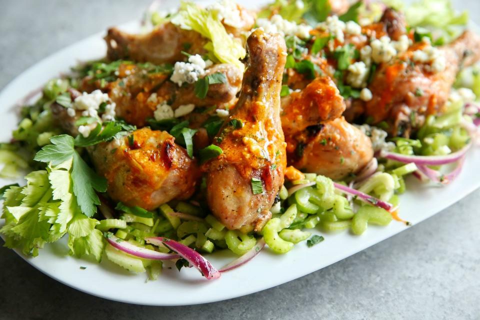 <p>Turn your favorite tailgate snack into dinnertime fare.</p><p>Get the recipe from <a href="/cooking/recipe-ideas/recipes/a47202/buffalo-chicken-drumsticks-with-celery-salad-recipe/" data-ylk="slk:Delish;elm:context_link;itc:0;sec:content-canvas" class="link ">Delish</a>.</p>