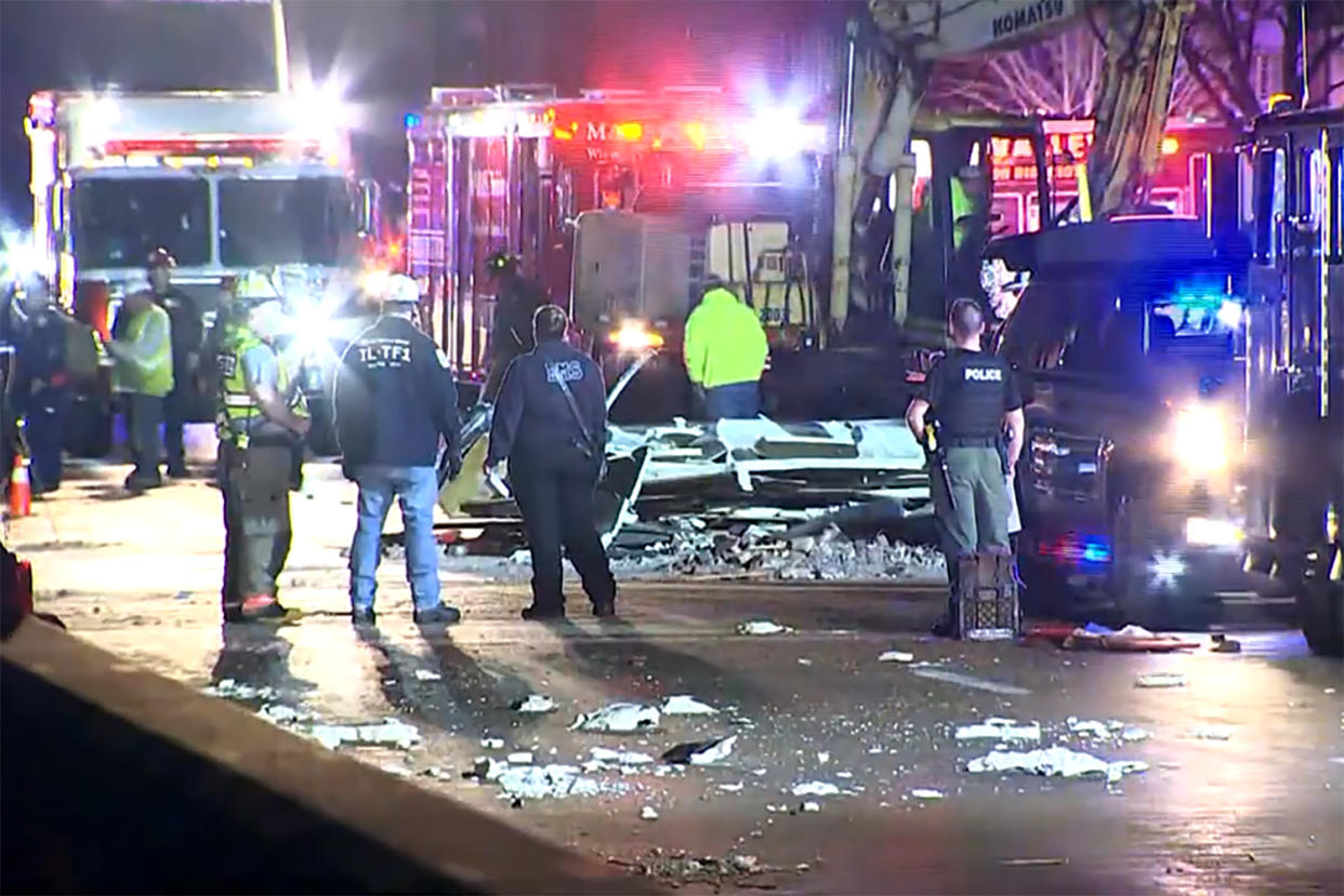 Emergency responders work the scene of a collapsed theatre in Belvidere, Ill., on Friday.  (WMAQ)