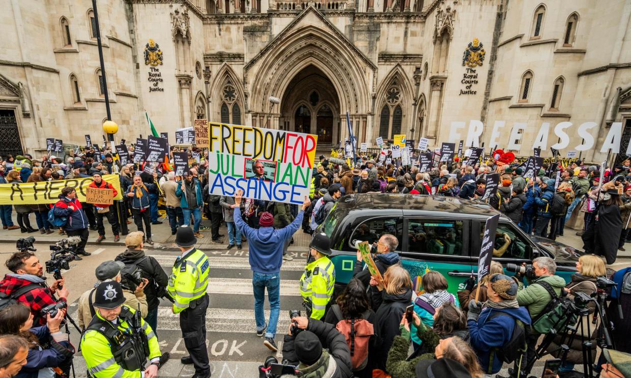 <span>Julian Assange supporters outside the Royal Courts of Justice in London in February.</span><span>Photograph: Guy Bell/Rex/Shutterstock</span>