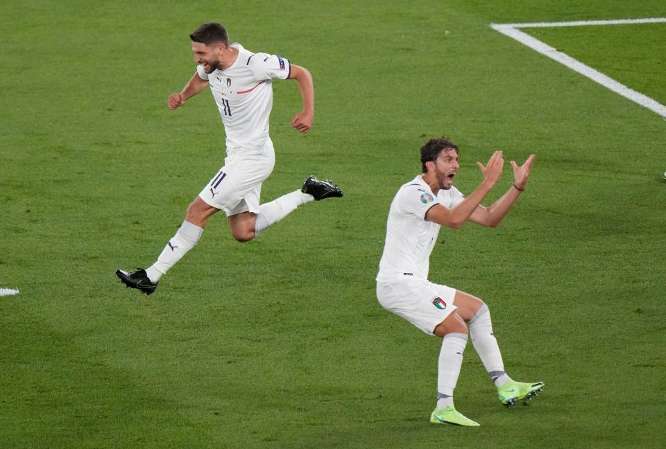 Italy’s Domenico Berardi, left, and Manuel Locatelli celebrate after Turkey’s Merih Demiral diverted the ball into his own net for the opening goal of Euro 2020 (AP)