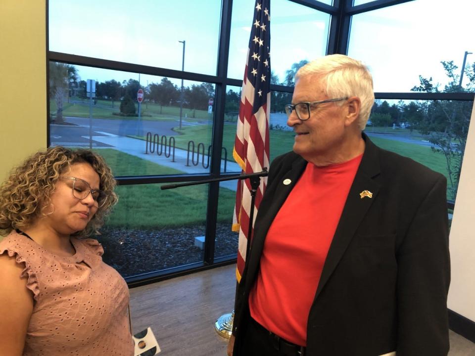 Fred Lowry, right, speaks with a voter following a July 22 debate in Deltona. Lowry is a pastor and Volusia County councilman.