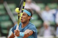 Tennis - French Open - Roland Garros - Rafael Nadal of Spain vs Facundo Bagnis of Argentina. - Paris, France - 26/05/16. Nadal returns the ball. REUTERS/Pascal Rossignol