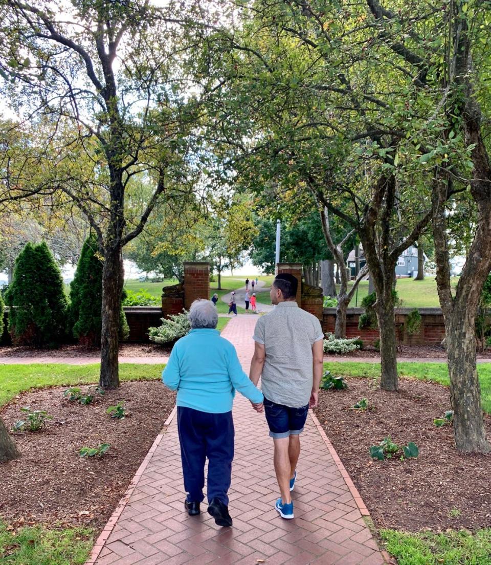 Juanita Lopez walks with her son, Juan Lopez, in this 2019 photo, the last walk they took together. She died of COVID-19 in April 2020.