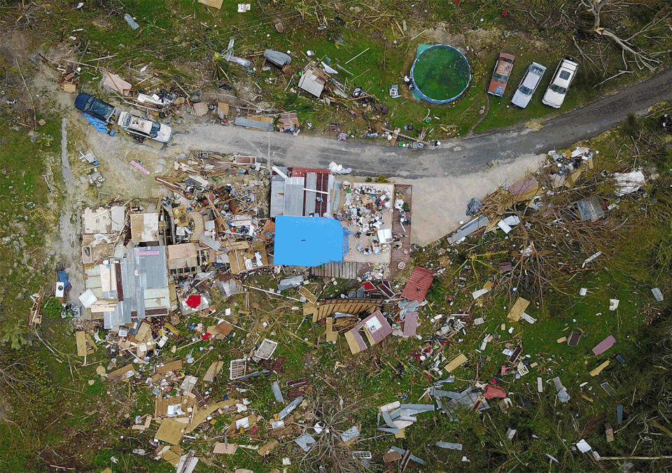 A house destroyed by hurricane winds is seen in Corozal on Sept. 24, 2017, and then on March 18, 2018.