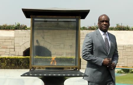 President of the United Nations General Assembly John Ashe walks at the Mahatma Gandhi memorial after paying flower tribute at Rajghat in New Delhi March 21, 2014. Ashe is on a four-day visit to India. REUTERS/Adnan Abidi/Files