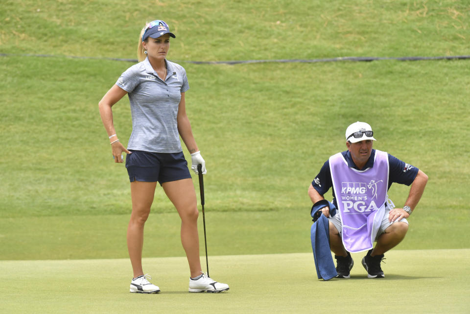 Lexi Thompson lines up a putt on the 16th green during the first round of the Women's PGA Championship golf tournament at Atlanta Athletic Club in Johns Creek, Ga. Thursday, June 24, 2021. (Hyosub Shin/Atlanta Journal-Constitution via AP)