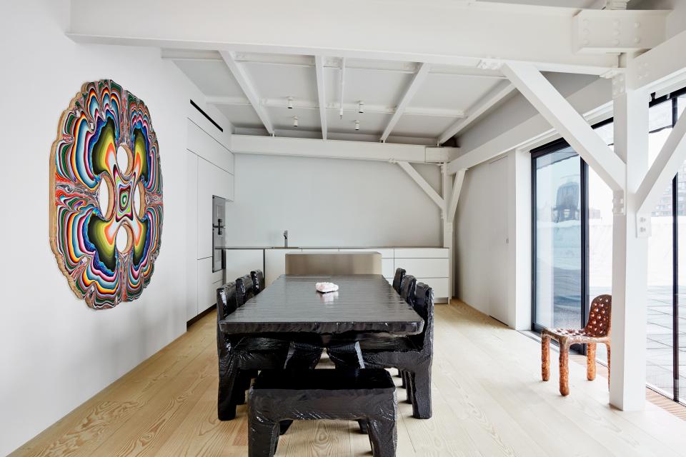 A Max Lamb dining suite and a painting by Holton Rower; kitchen by Bulthaup with Gaggenau appliances.