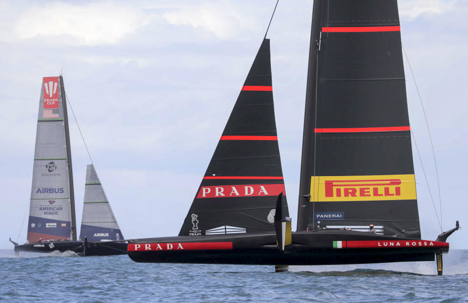 United States' American Magic, left, sails against Italy's Luna Rossa on the third day of racing of the America's Cup challenger series on Auckland's Waitemate Harbour, New Zealand, Sunday, Jan. 17, 2021. (Michael Craig/NZ Herald via AP)