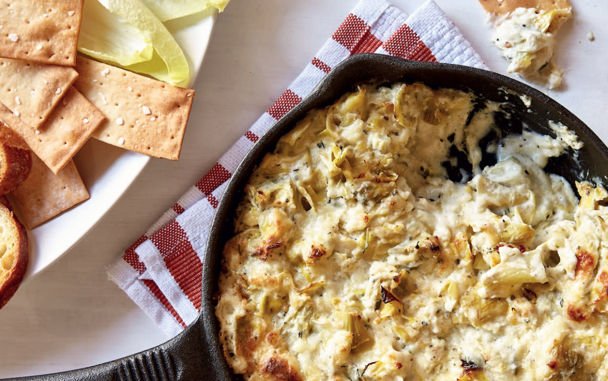<p>Photo by Paul Brissman</p><p>This Cheesy Lemon-Rosemary Artichoke Dip is Antoni Porowski’s (the charming food guy on the Netflix hit series <em>Queer Eye</em>) spin on an American classic. </p><p><strong>Get the recipe: <a href="/893654/parade/cheesy-lemon-rosemary-artichoke-dip/" data-ylk="slk:Cheesy Lemon-Rosemary Artichoke Dip;elm:context_link;itc:0;sec:content-canvas" class="link rapid-noclick-resp">Cheesy Lemon-Rosemary Artichoke Dip</a></strong></p>