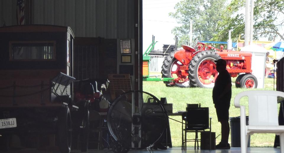 A man stands in the Crawford Museum of Agriculture on Wednesday afternoon at the Crawford County Fair.